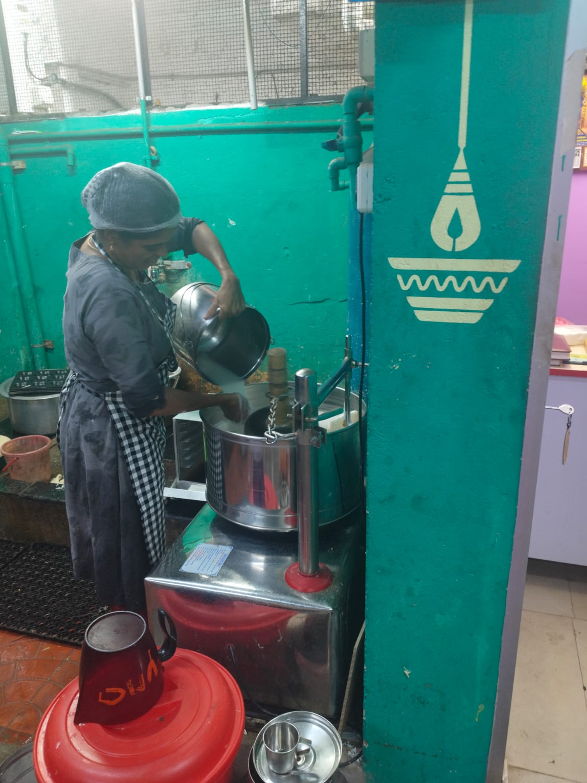 Fresh batter grinding in heavy-duty commercial wet grinders for soft idlis and dosas