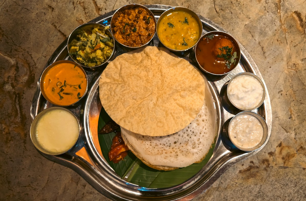 Vel Murugan Caters traditional royal appam and virundhu feast with assorted curries